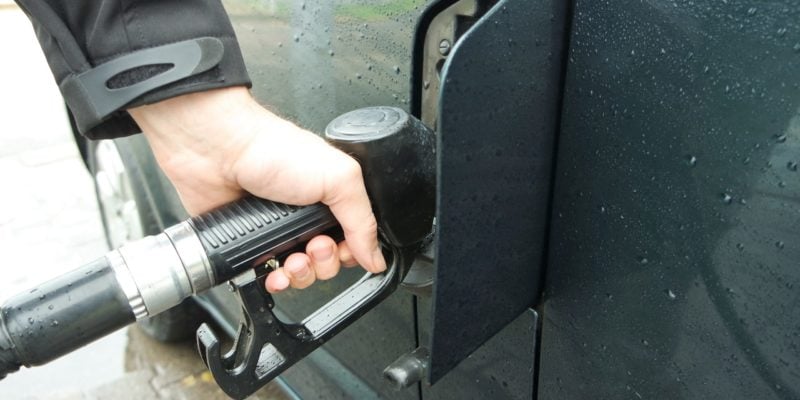 Person Filling Gas Tank